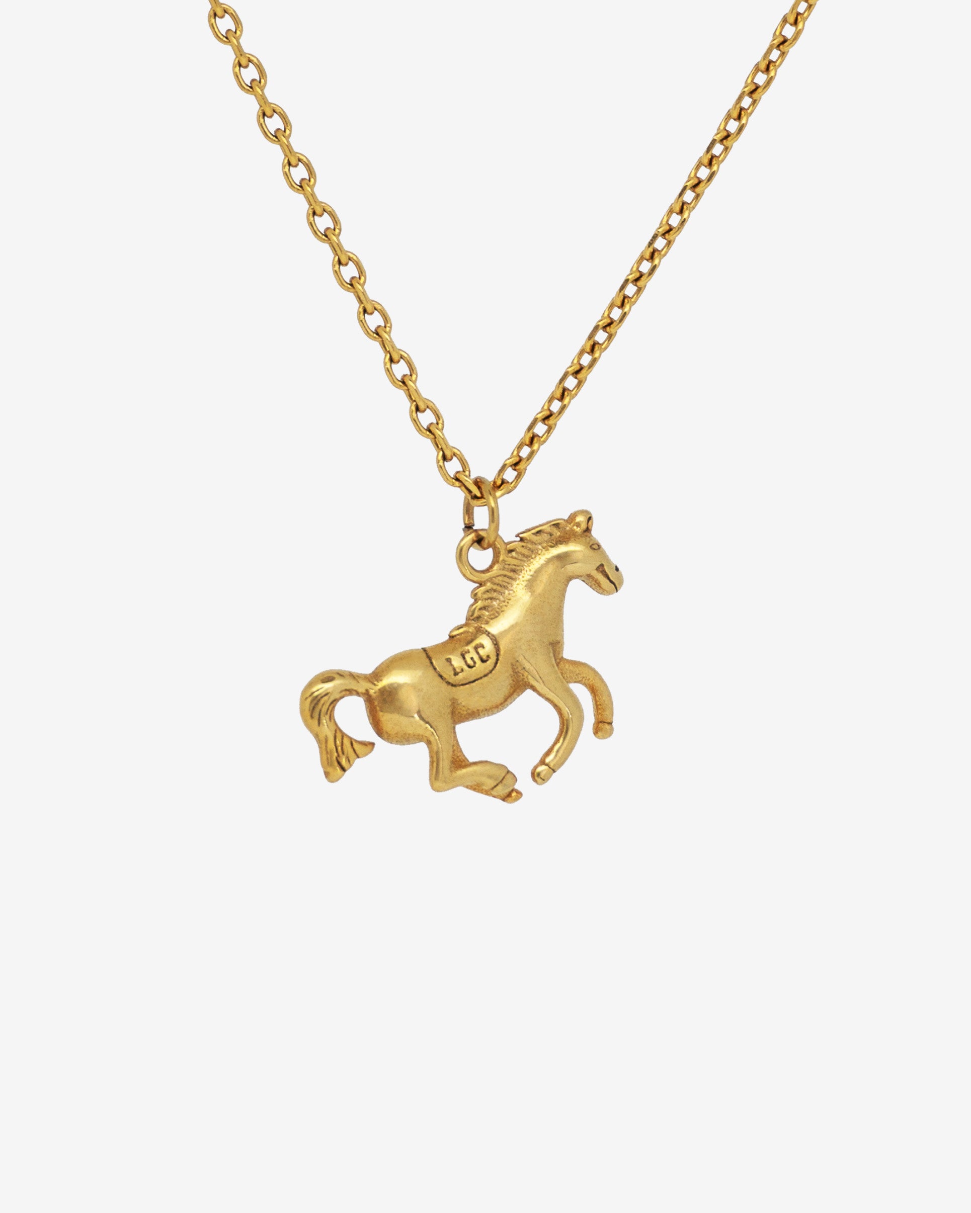 Monaco Gold Necklace featuring a detailed horse pendant and an adjustable chain