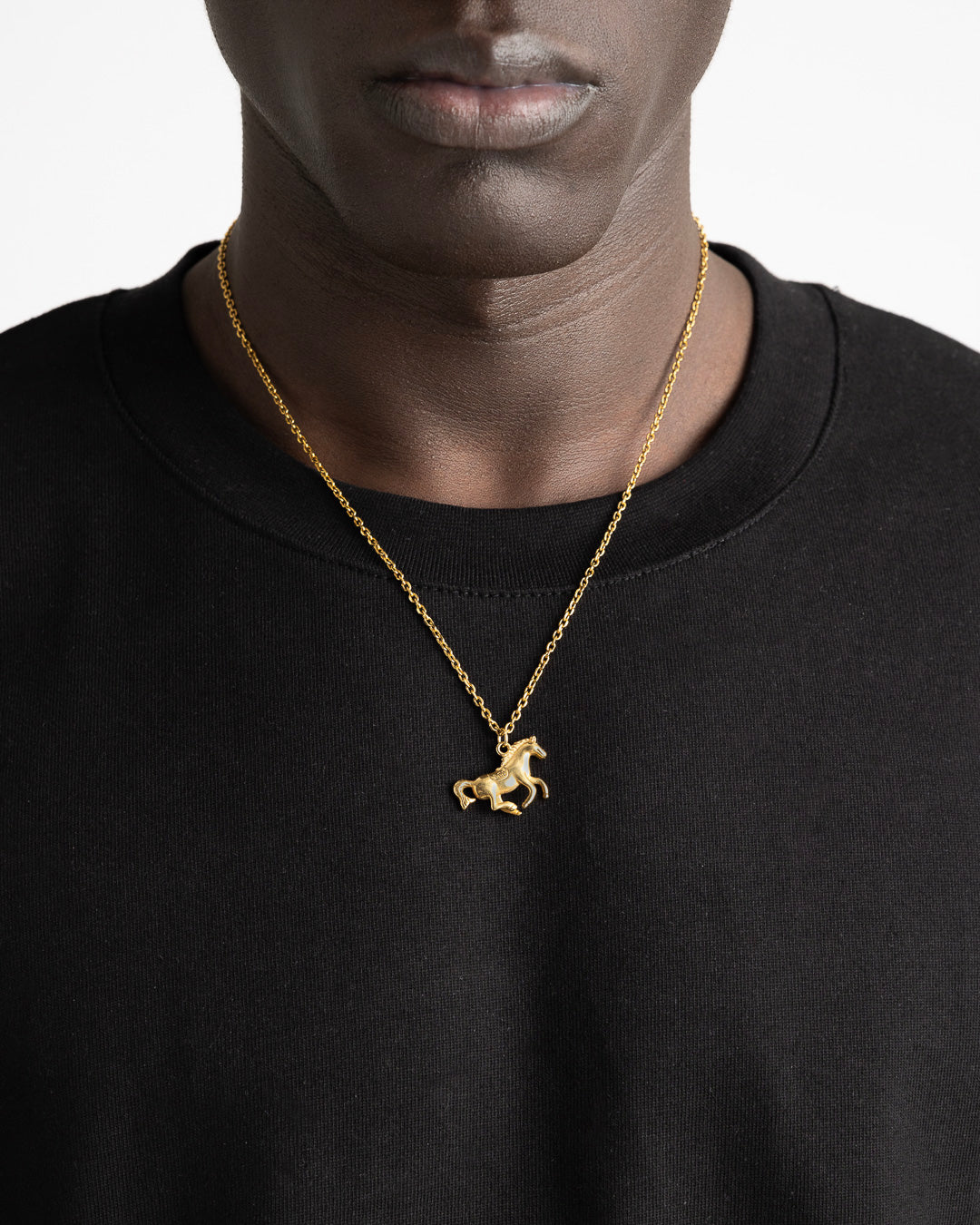 Monaco Gold Necklace featuring a classic horse pendant on a black crew neck, 50 cm chain with 5 cm adjustable.