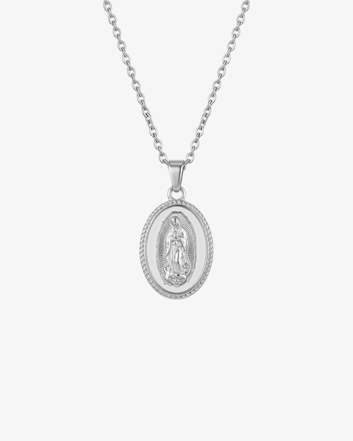 Silver chain necklace with an oval Virgin Mary pendant on white enamel background.