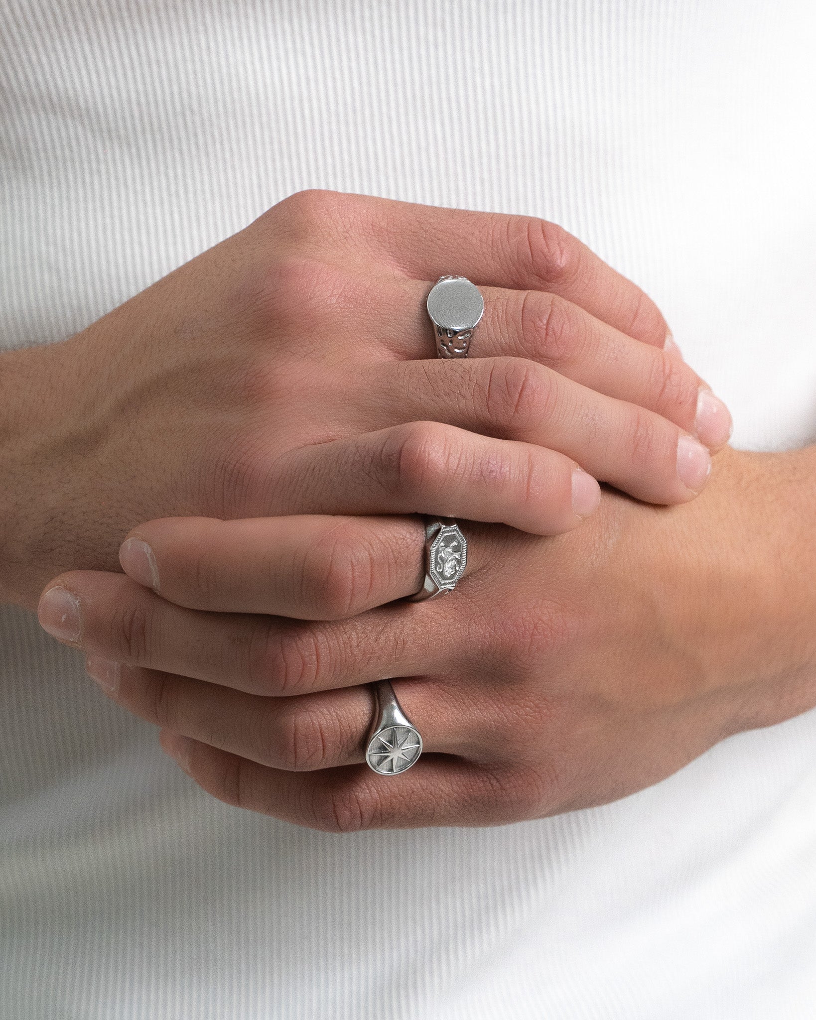 Legacy Silver Ring with a smooth circular face worn on a finger