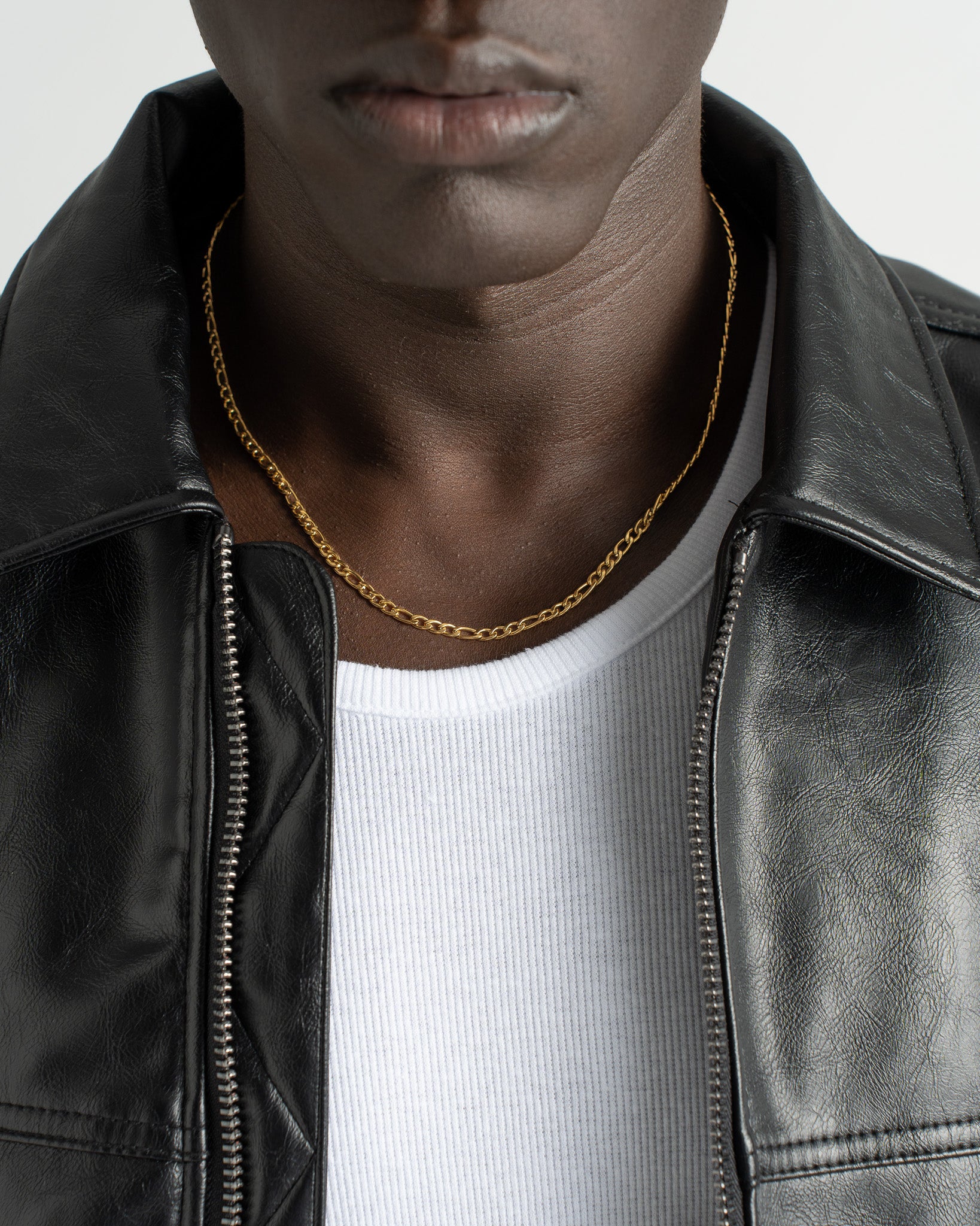 Amalfi Gold Chain necklace visible on a model wearing a black leather jacket
