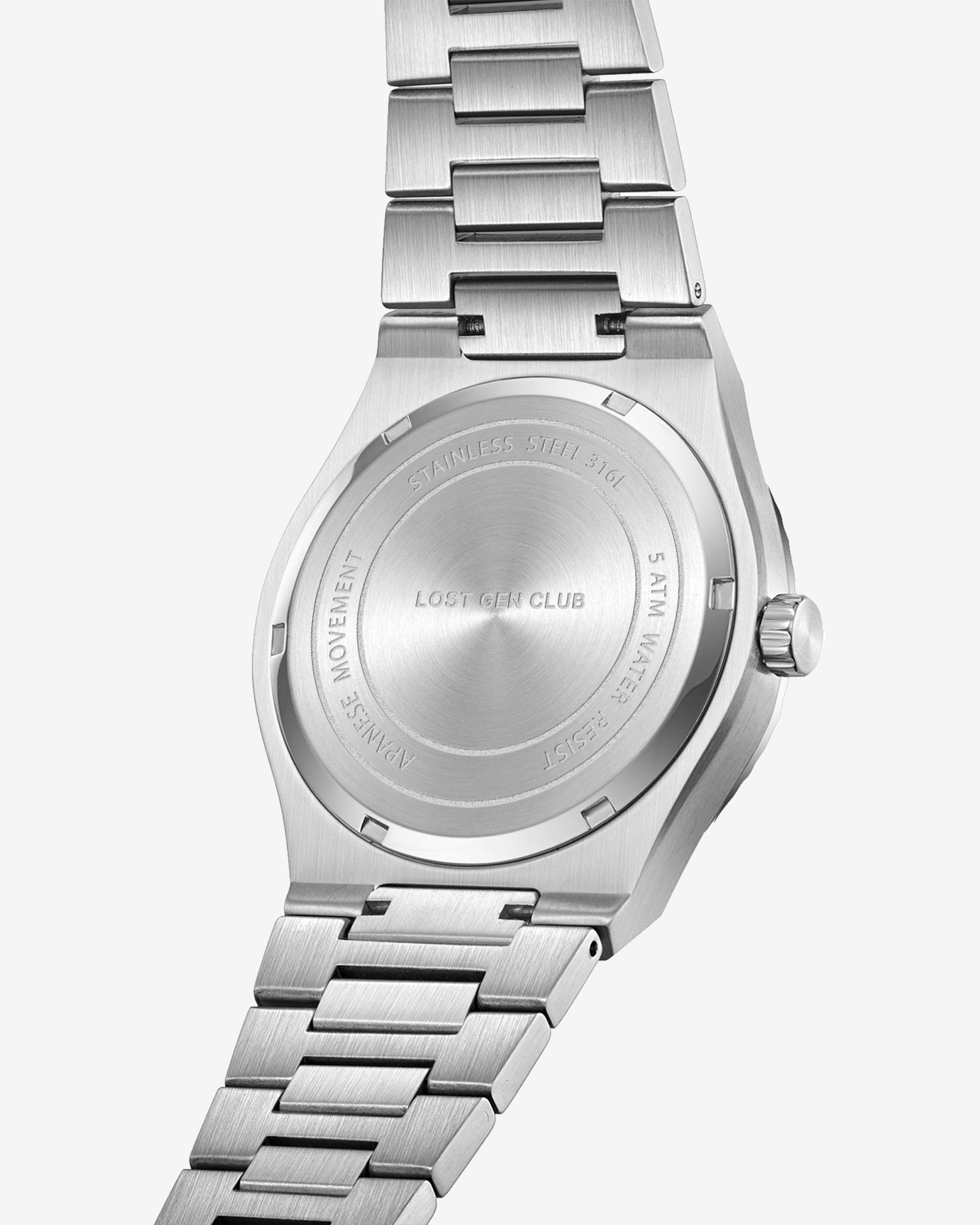 Wrist shot of AUREN watch showing blue grid dial and stainless steel bracelet