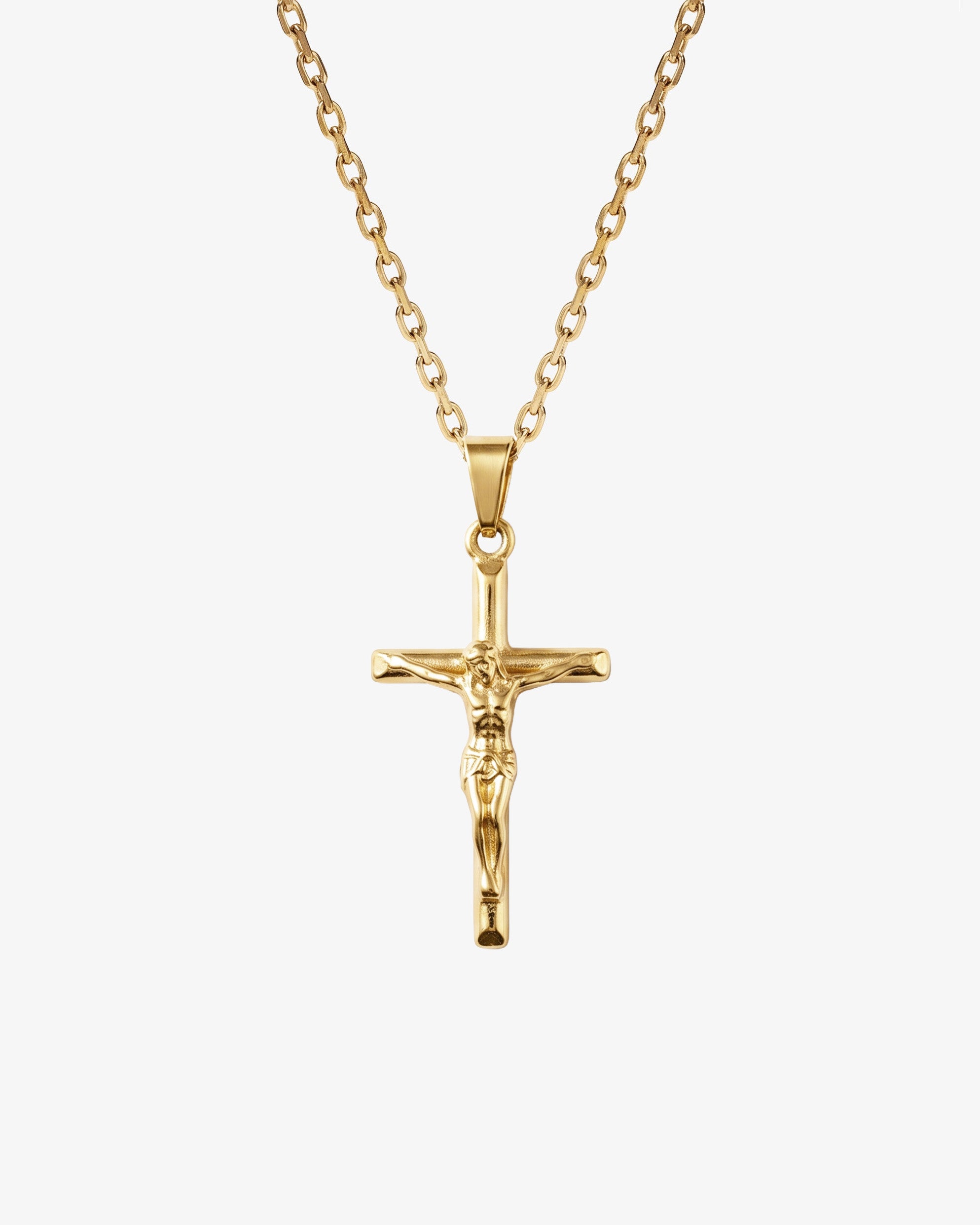 Gold crucifix necklace with chain against a white background