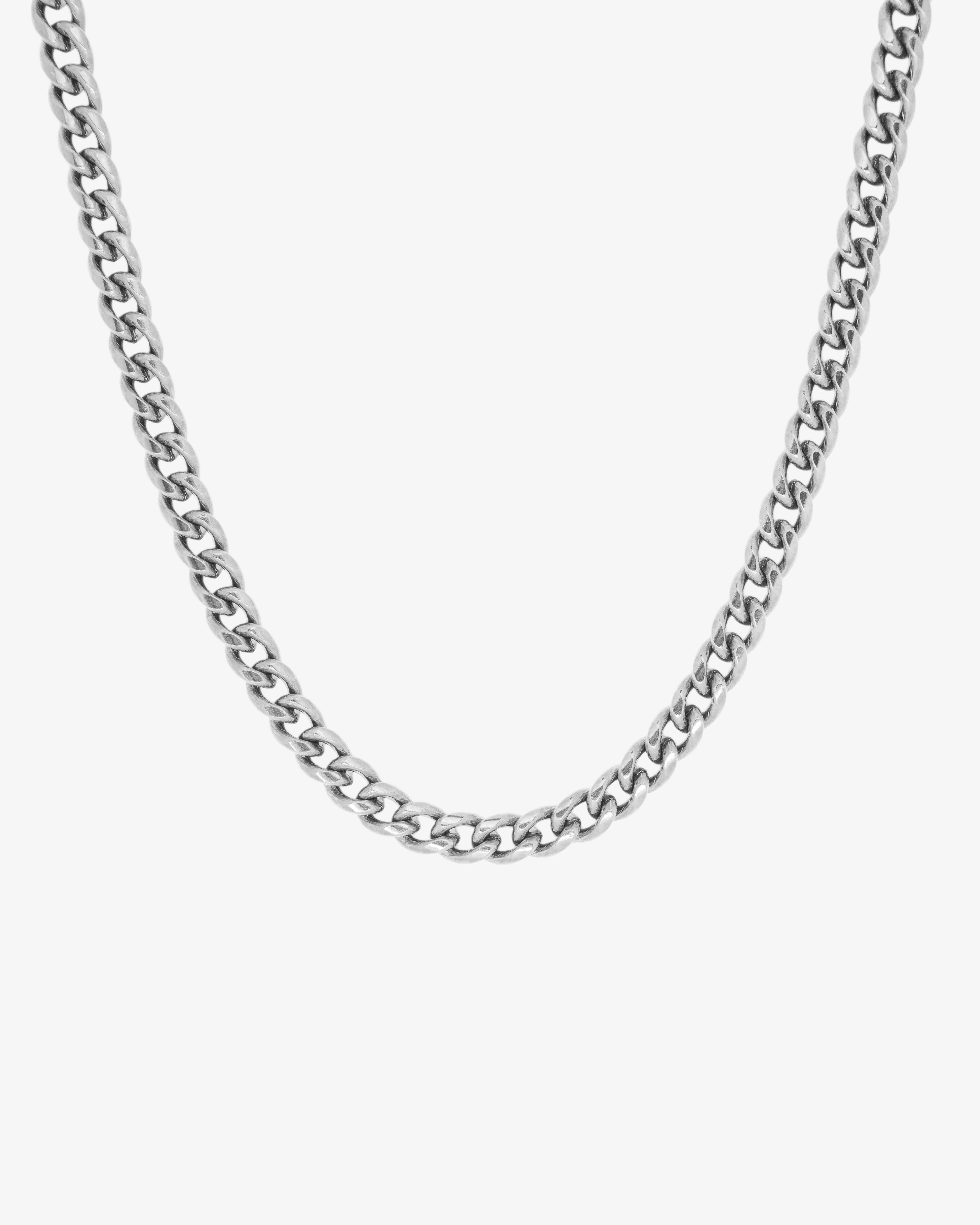 Close-up of a 5mm silver Cuban link chain necklace against a white background.