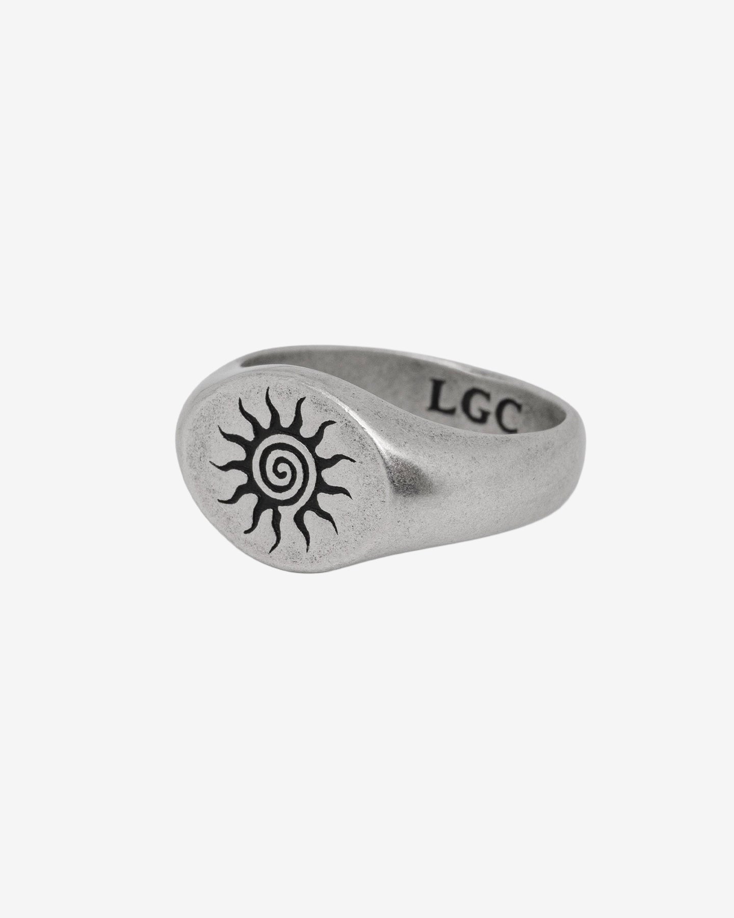 ENERGY SILVER RING with a sun spiral engraving on a brushed silver band on a white background