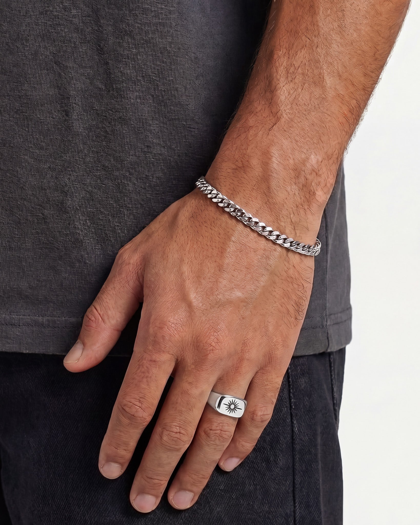 Horizon Silver Ring with sunburst motif worn on the finger