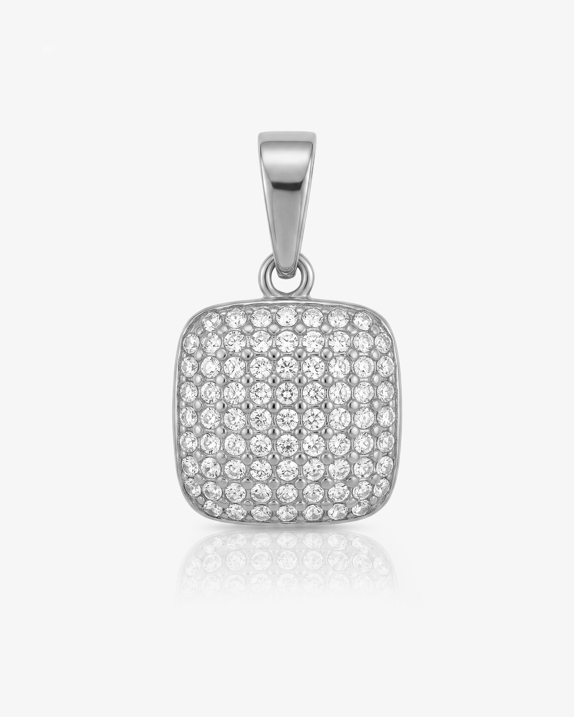 Mini Icy Charm pendant with a red gemstone surrounded by pavé diamonds in a silver setting.