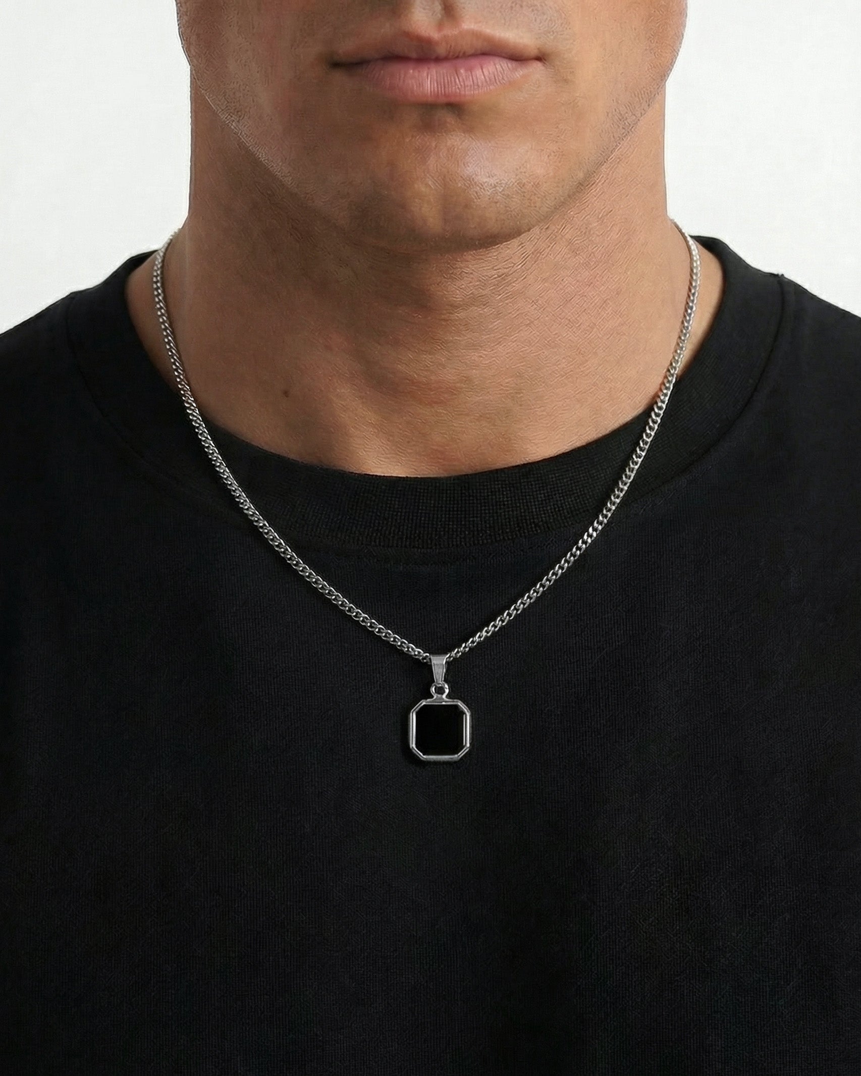 NOVA Silver Necklace worn by a man with a square dark stone pendant on a silver chain