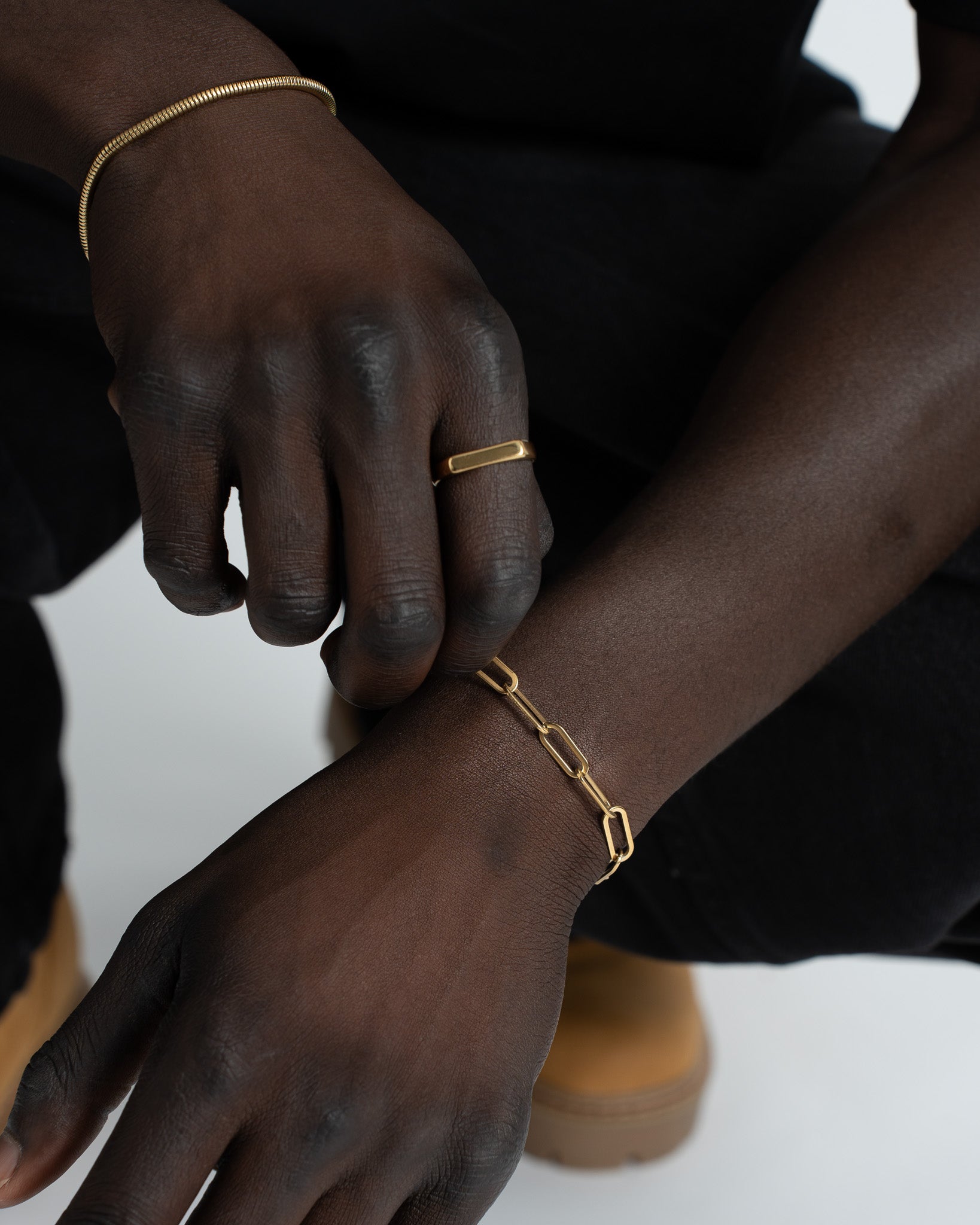 Close-up of Debod gold bracelet on the wrist highlighting rectangular link design and clasp