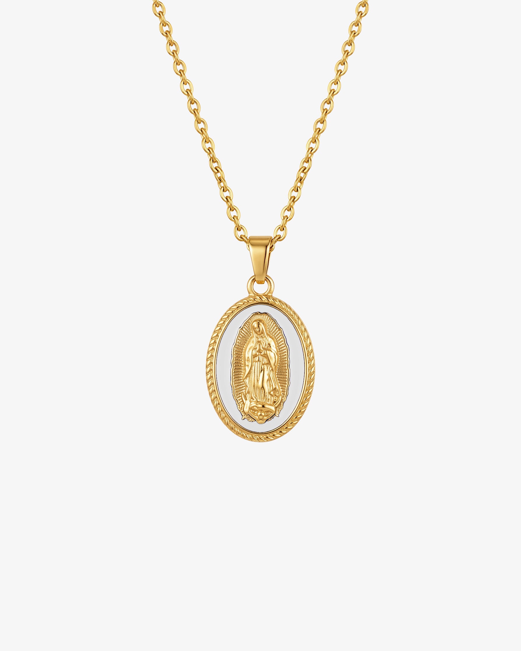 Gold chain necklace with an oval Virgin Mary pendant on white enamel background.