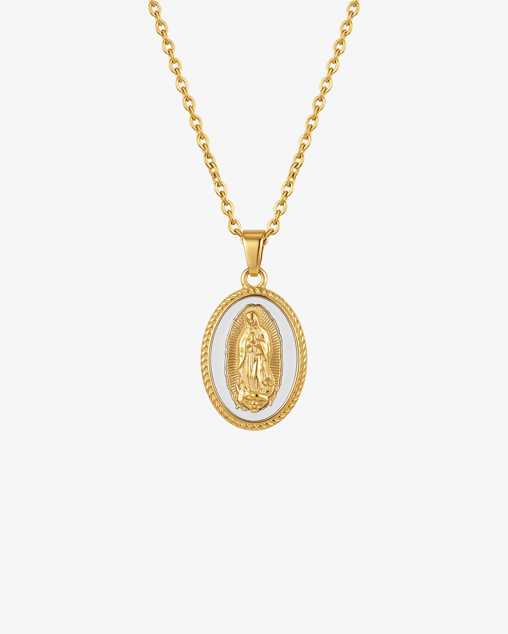 Gold chain necklace with an oval Virgin Mary pendant on white enamel background.